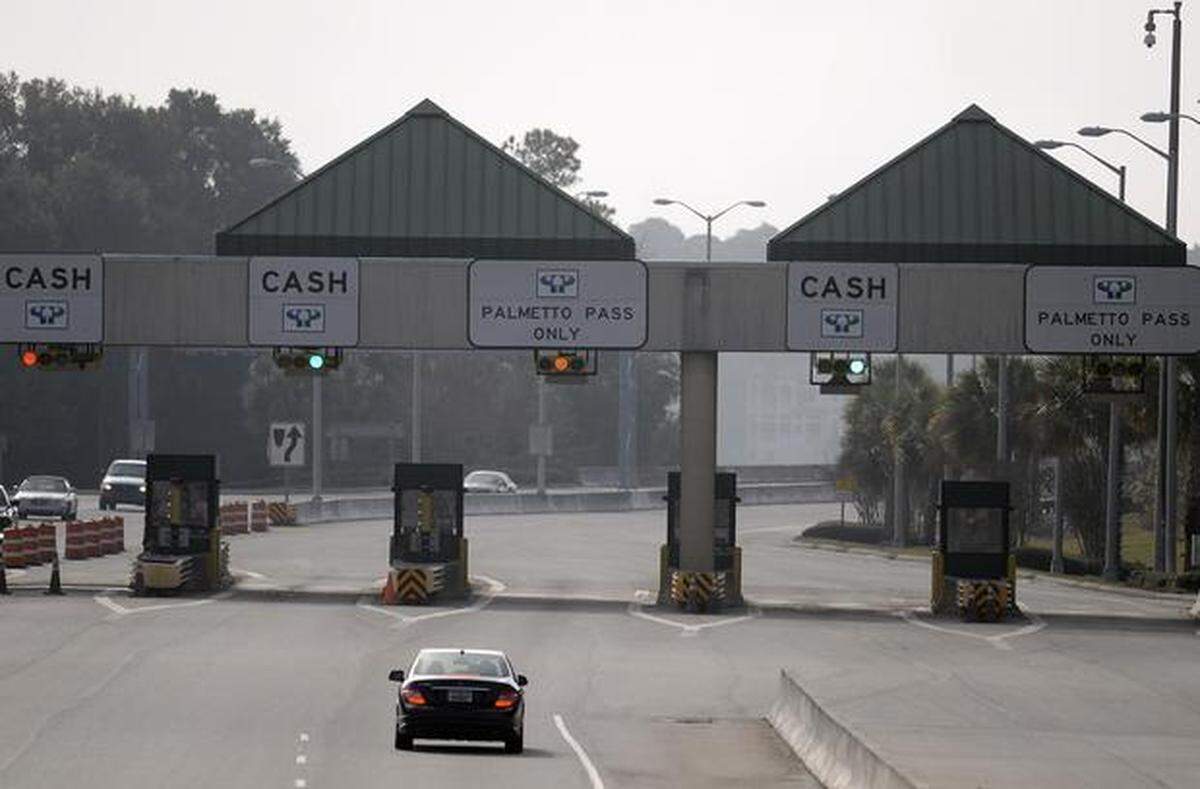 Cars approach the toll facility on Hilton Head’s Cross Island Parkway. As of July 2021, the toll booths will be removed from the road and drivers will be able to use it for free.