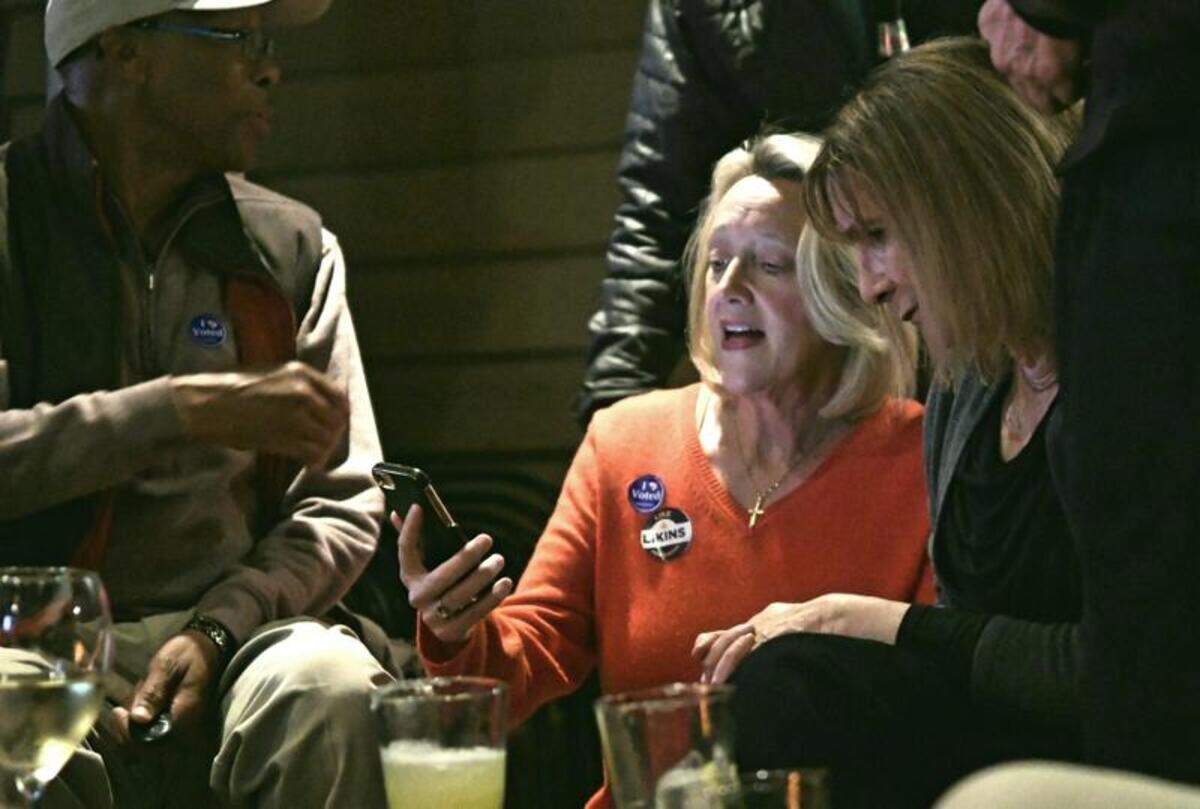 Hilton Head Island mayoral candidate Kim Likins waits for results in Tuesday’s runoff for mayor while reading an email to her supporters at Santa Fe Cafe.