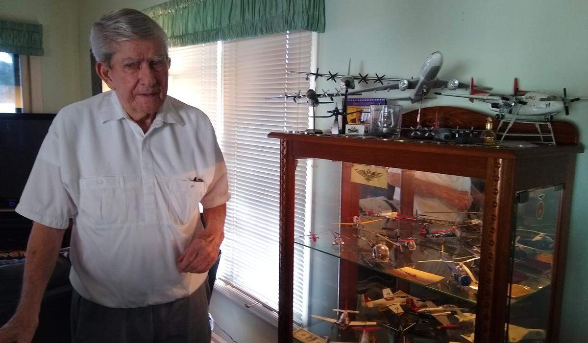 At his Lady’s Island home, Col. Joseph R. Dobbratz Jr. stands next to a glass case displaying models of the about 20 different aircraft he flew during his 30 years as a Marine Corps pilot.