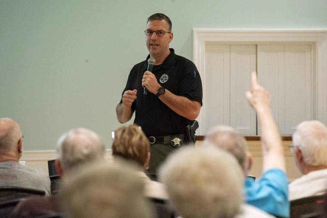 Lt. Eric Calendine of the Beaufort County Sheriff’s Office takes questions from residents after a presentation on cryptocurrency scams at Sun City Hilton Head, a 55-plus gated community in Beaufort and Jasper counties. South Carolina’s aging population is increasingly targeted by fraudsters who drain victims’ wallets through cryptocurrency ATMs.