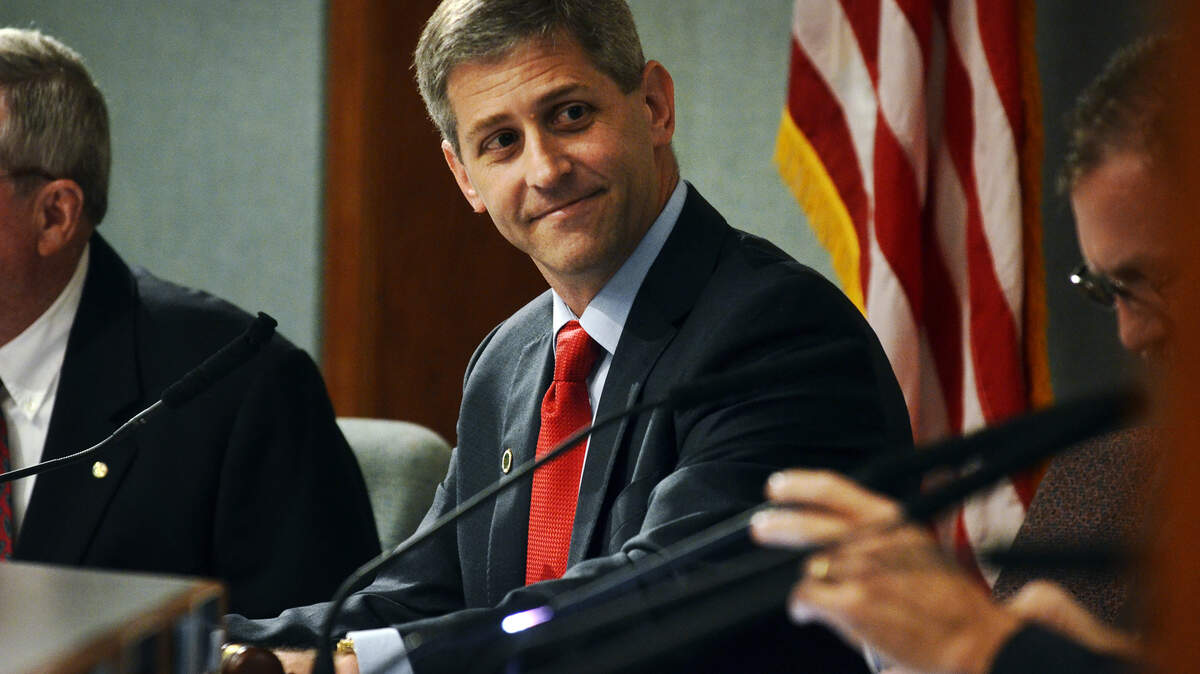 David Bennett takes his seat during his first town council meeting as the new Mayor of Hilton Head Island on December 2, 2014.
