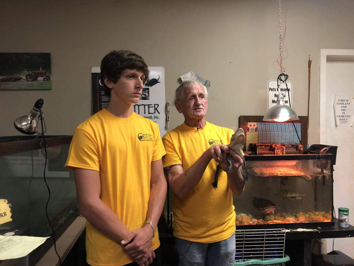Joey Maffo (left) and his grandfather Joe Maffo answer press questions at their Hilton Head-based business Critter Management in 2020.