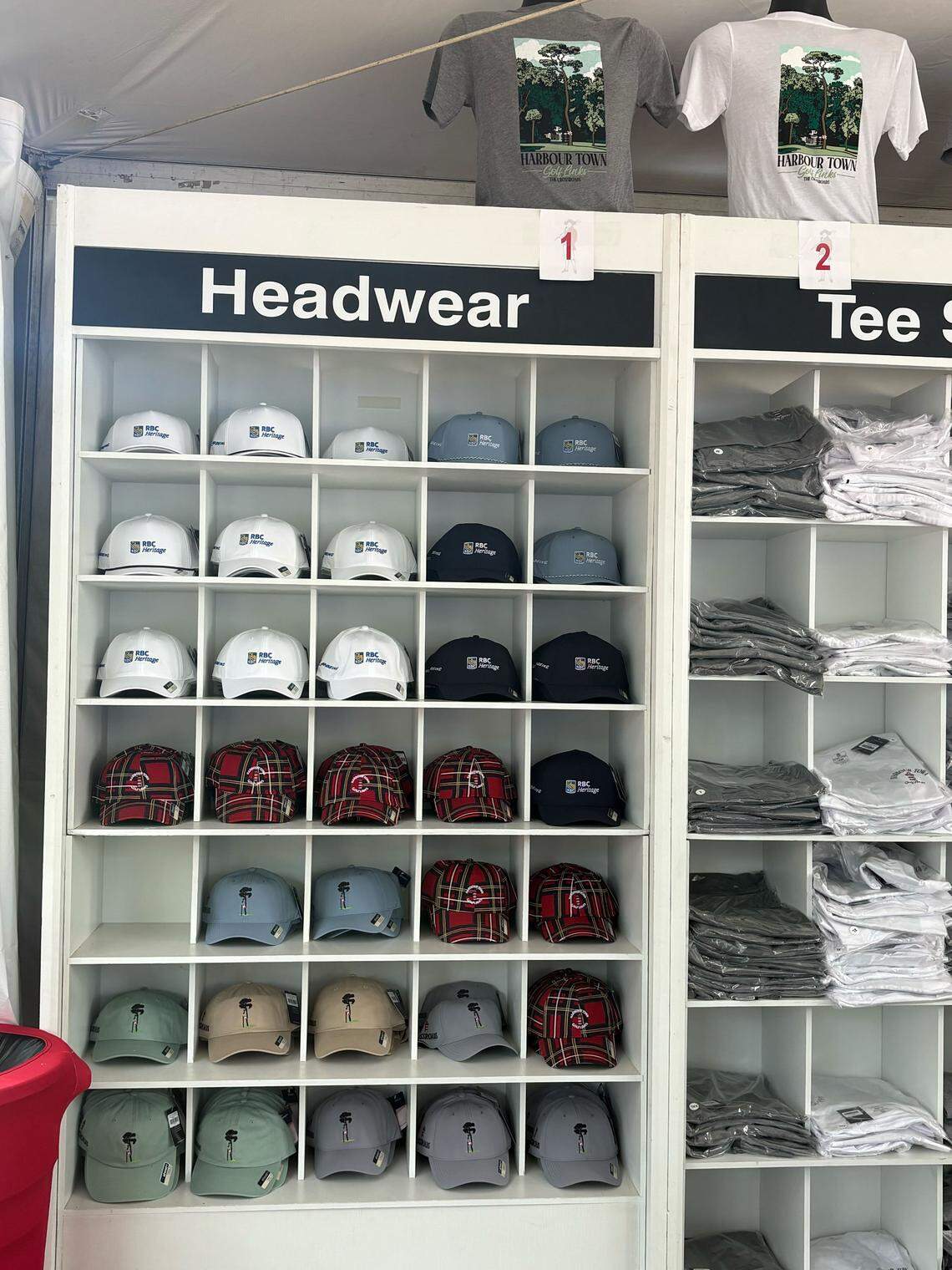 A wide selection of baseball caps at the merchandise tent at the 6 7 Crossroads at RBC Heritage at the Sea Pines Resort in 2026.
