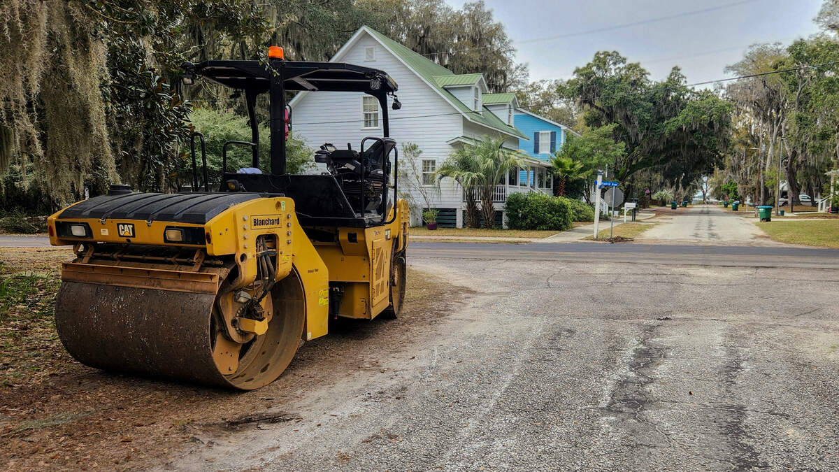 A ride-on roller sits on the corner of Madrid Ave. and 13th St. on Tuesday, March 5, 2024 in the Town of Port Royal. Workers with Charlotte-based Blythe Construction will repave most of the town’s roads with the exception of Paris Avenue and will take three to four weeks.