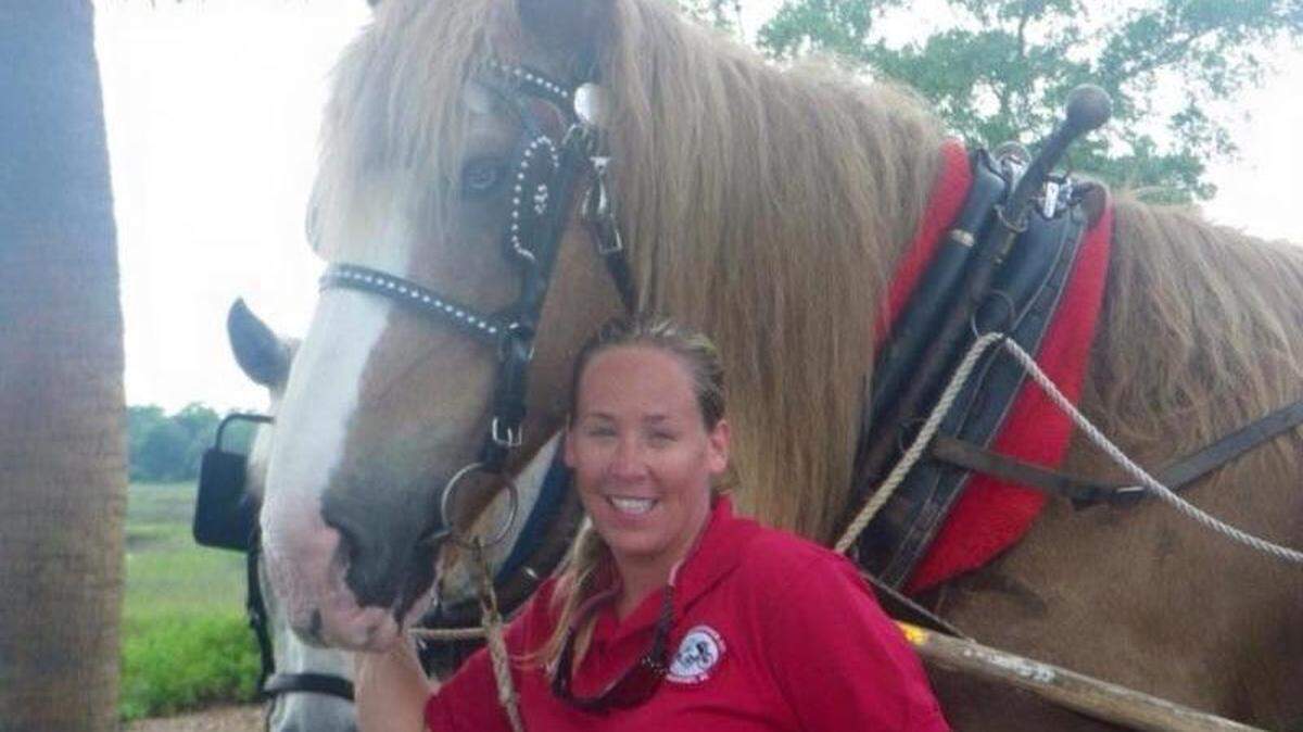 Sea Island Carriage Company owner Nichole Myers is pictured with recently retired carriage-tour horse Doc.