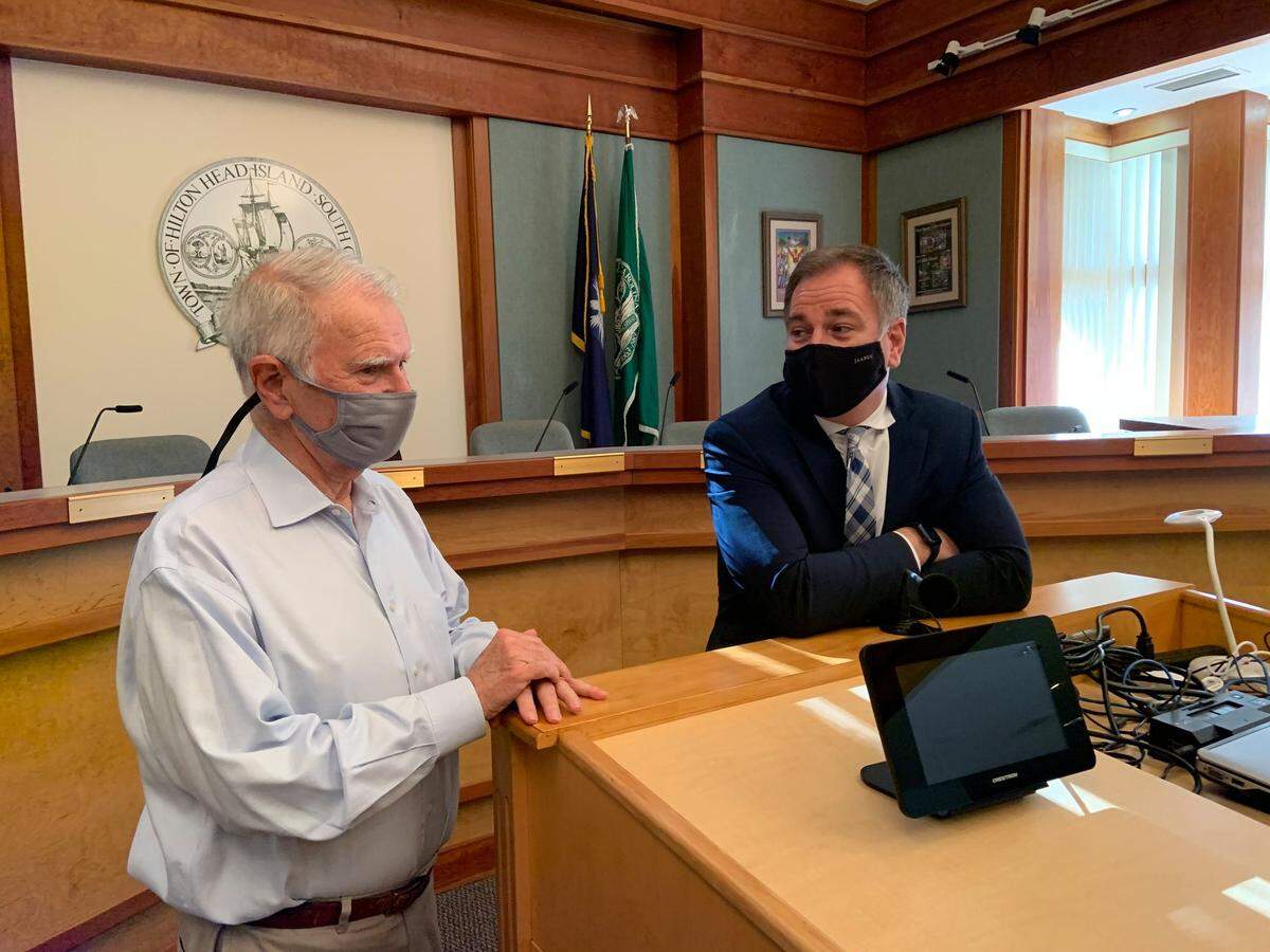 Former Hilton Head Island Mayor John McCann (left) speaks with Town Manager Marc Orlando on Orlando’s first day on the job on Feb. 22, 2021.