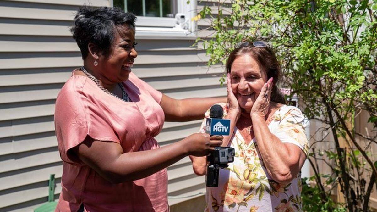 Josephine Montgomery, a retiree from Long Island, New York, is surprised by HGTV’s Tiffany Brooks with the news that she is the winner of the HGTV Smart Home Giveaway 2018.