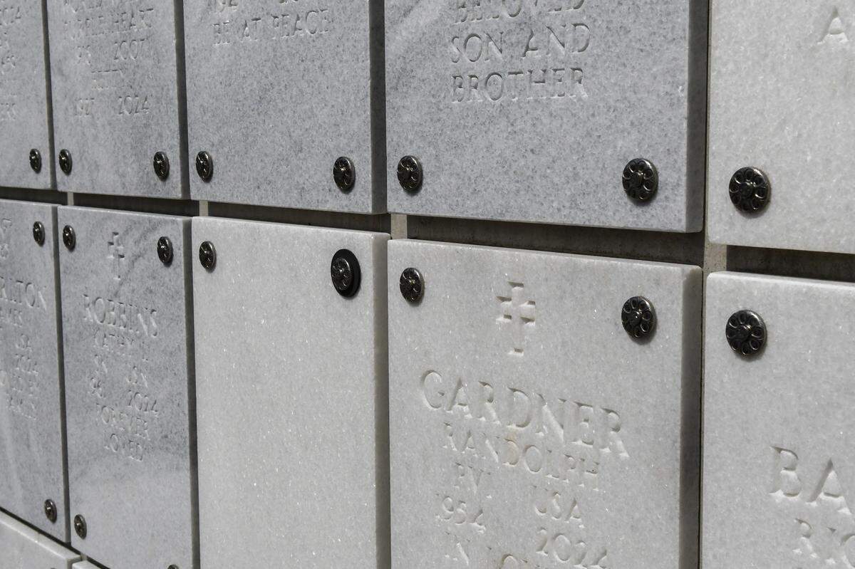 A black washer on a blank faceplate denotes that the space in the columbarium is reserved as photographed on Monday, March 3, 2025, at Beaufort National Cemetery. Part of the project to expand the cemetery includes a 2,500-niche columbarium plaza on a 2.5-acre section in the northeast corner of the cemetery.