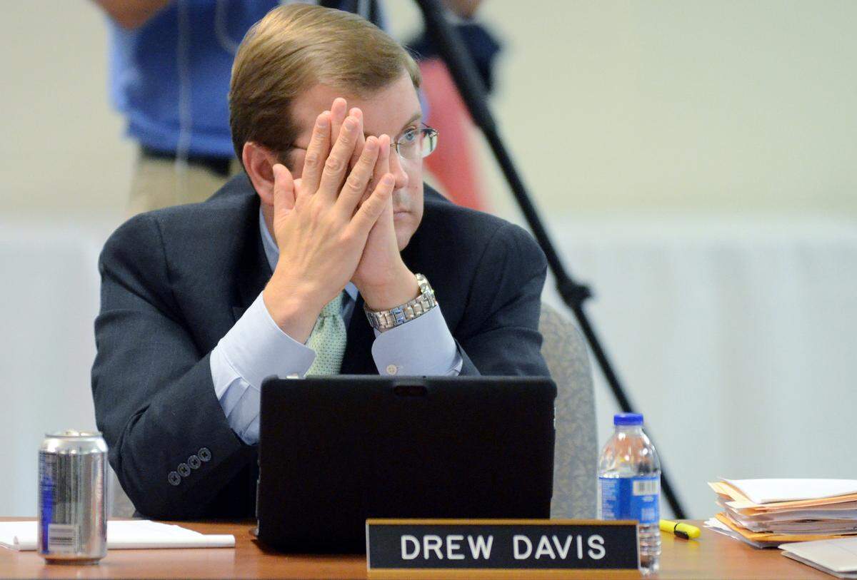 Beaufort County School District lawyer Drew Davis listens as a member of the public makes a statement as the Beaufort County School Board holds a special meeting on Monday to discuss issues surrounding the hiring of Superintendent Jeff Moss' wife to an administrative position with the district.