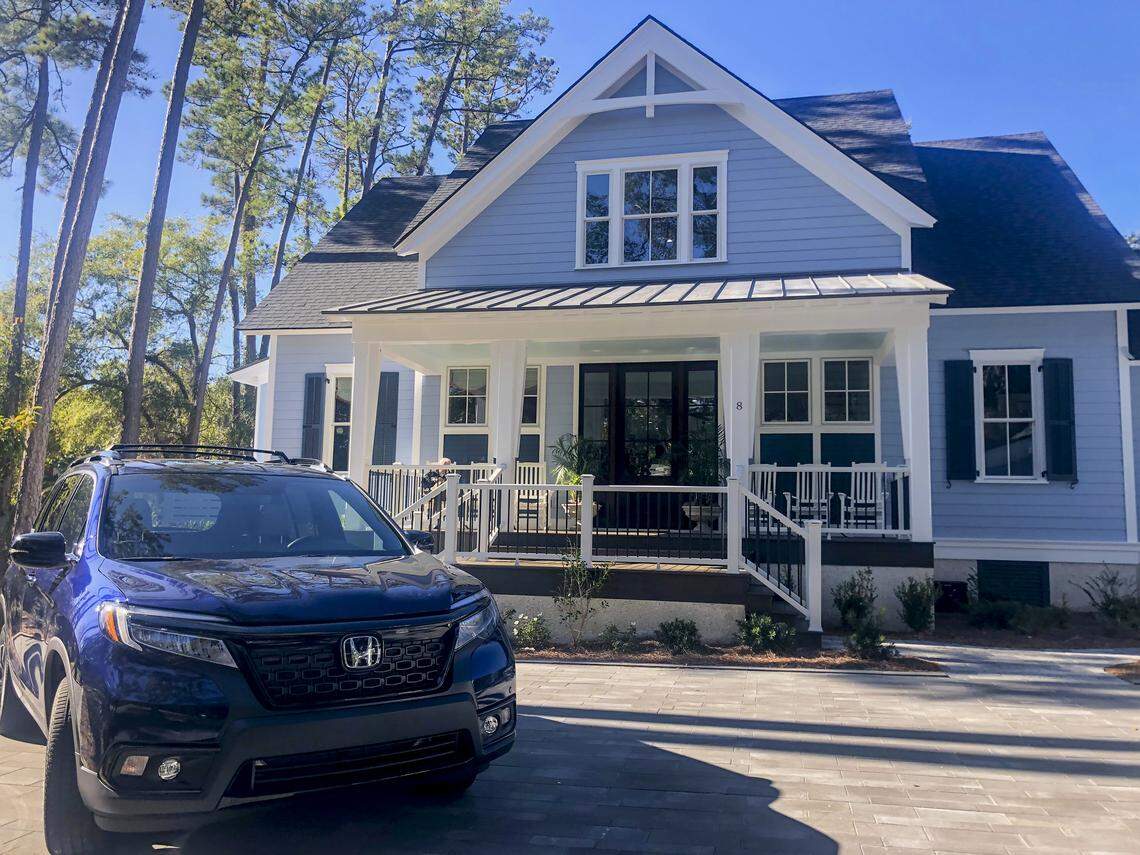 The HGTV 2020 Dream Home in Windmill Harbour on Hilton Head Island, with a Honda Passport Elite parked in its driveway. The winner of the giveaway will win both the car and home.