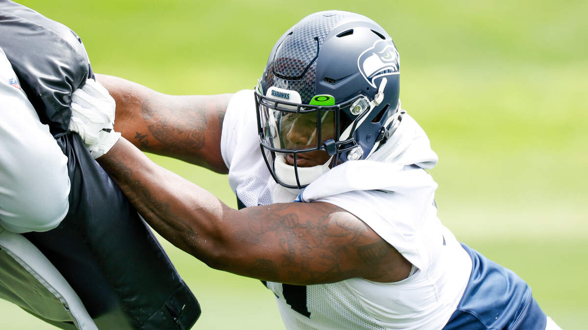 Seattle Seahawks defensive tackle Poona Ford (97) participates in a drill during minicamp practice at the Virginia Mason Athletic Center Field.