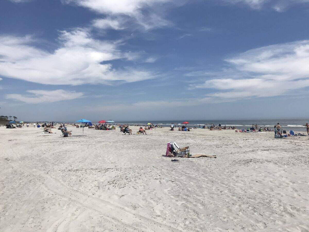 The beach outside the Mariott Hotel in Palmetto Dunes is fairly packed with tourists, as the coronavirus sweeps across South Carolina.