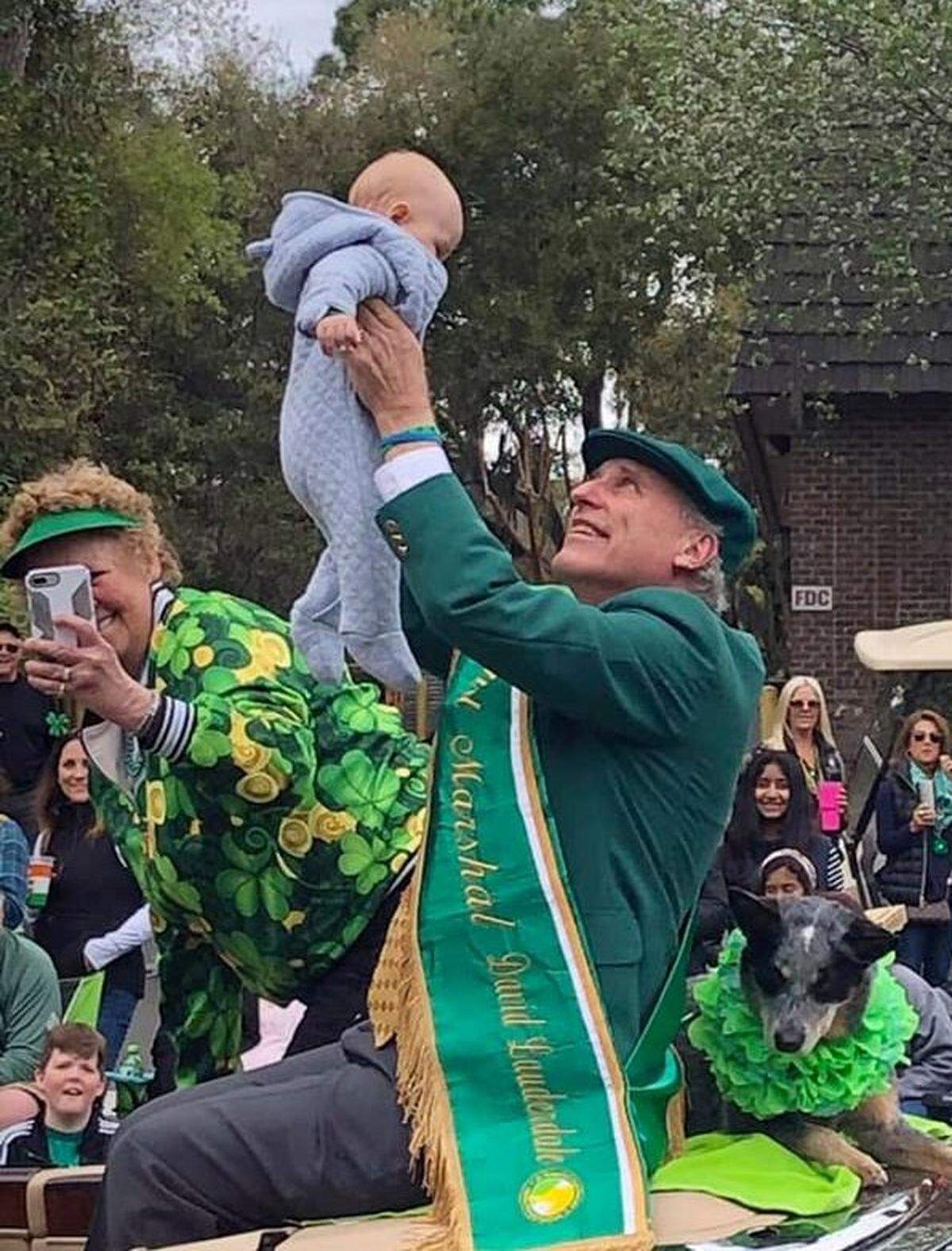 David and Sybil Lauderdale, with blue heeler Shasta, celebrate grandson, Bram Lauderdale, when David was grand marshal of the Hilton Head St. Patrick’s Day Parade in 2019.