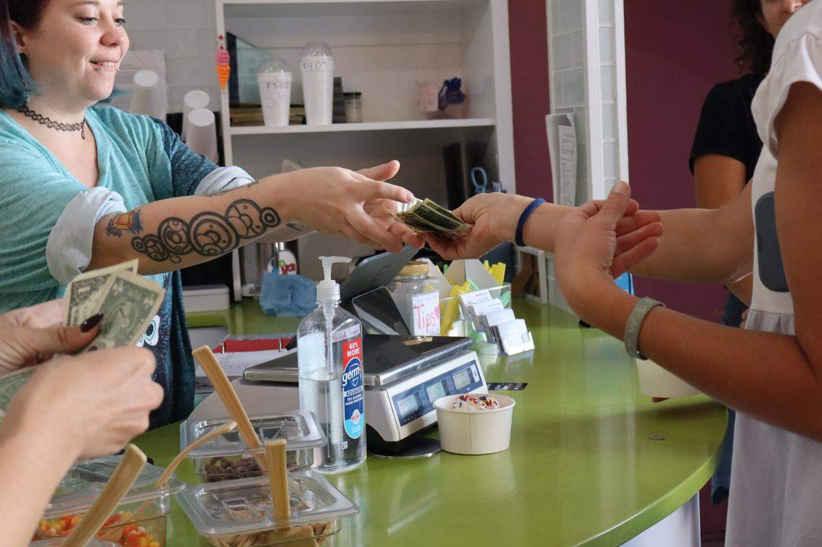 Customers at YoYo’s Ice Cream in downtown Beaufort counted dollar bills and quarters as they paid for their frozen treats Monday afternoon, when widespread internet and cell service outages across the Lowcountry shut down the payment processing systems of local businesses.