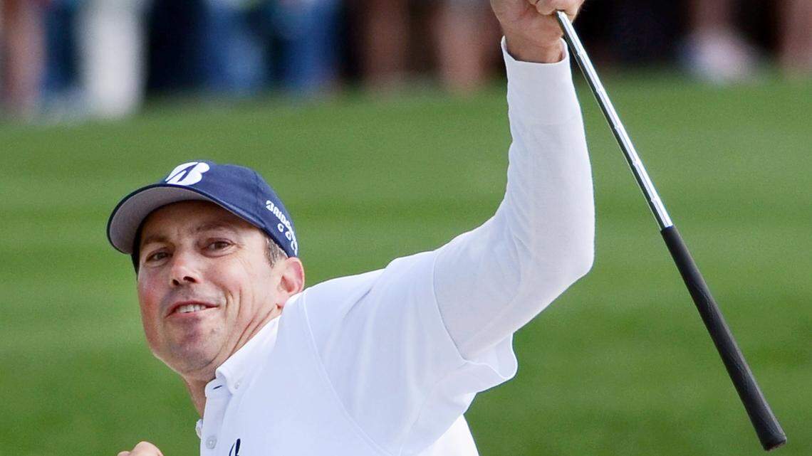 Matt Kuchar reacts after his chip shot for birdie from the bunker on No. 18 finds the hole to clinch the 2014 championship of the RBC Heritage Presented by Boeing on Sunday at Harbour Town Golf Links in Sea Pines on Hilton Head Island S.C. The birdie propelled him to sole possession of the lead at 11-under-par, one stroke better than runner up Luke Donald.