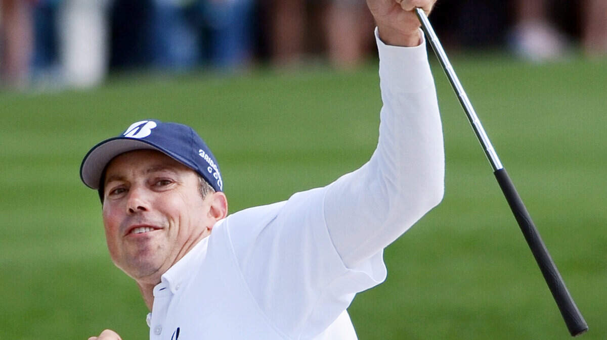 Matt Kuchar reacts after his chip shot for birdie from the bunker on No. 18 finds the hole to clinch the 2014 championship of the RBC Heritage Presented by Boeing on Sunday at Harbour Town Golf Links in Sea Pines on Hilton Head Island S.C. The birdie propelled him to sole possession of the lead at 11-under-par, one stroke better than runner up Luke Donald.