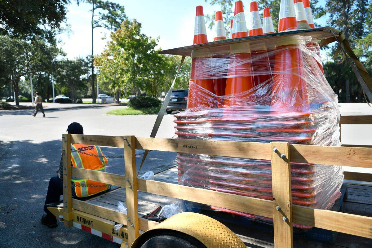Traffic cones, stacked on the back of a South Carolina Department of Transportation trailer, are seen on Tuesday morning in a staging area off of US 278 just before the bridges to Hilton Head Island. Workers arrived at 7 a.m. and were positioned along the entire stretch of the highway from Hilton Head to Interstate 95 for the possibility of converting an eastbound lane for westbound traffic if the highway became too congested. At 11:30 a.m., the governor called off the mandatory evacuation for Beaufort, Jasper and Colleton counties after Hurricane Florence’s path was maintaining a North Carolina landfall.