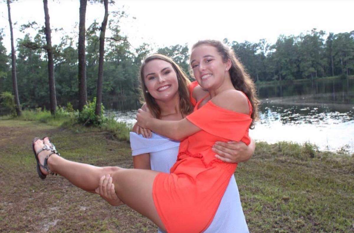 Dallas Stoller holding her close friends since seventh grade, Alyson Hay, in South Carolina. The two were always together in their hometown of Orangeburg, South Carolina, playing volleyball or spending hours talking.
