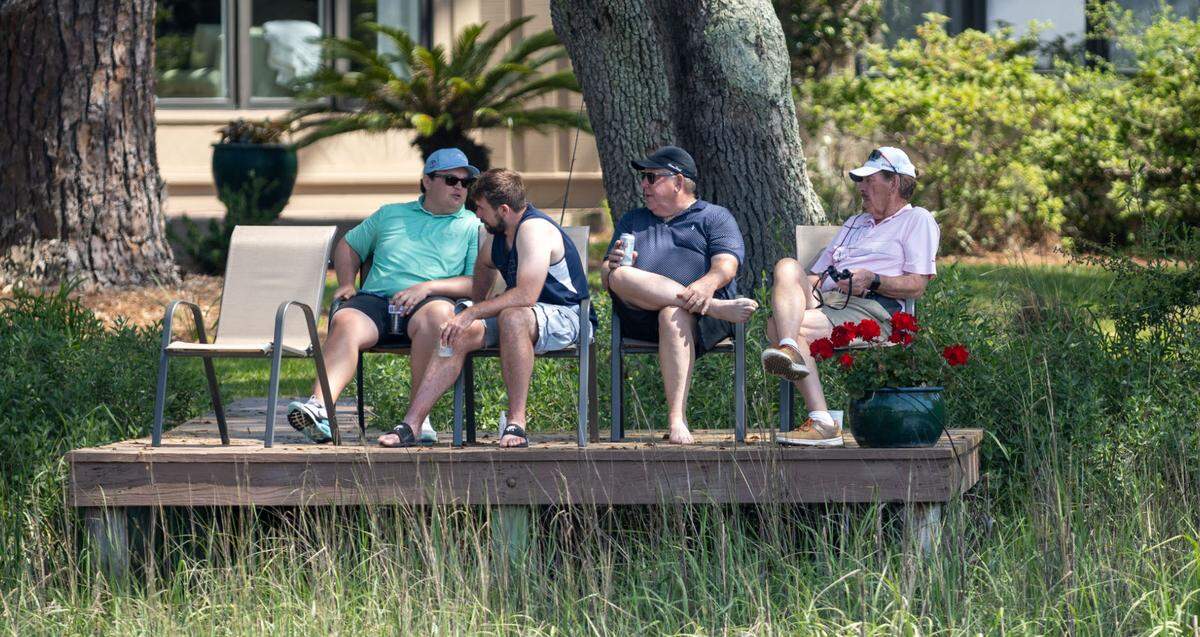 A group of spectators take advantage of their view across from the 16th green during the second round of the RBC Heritage Presented by Boeing at Harbour Town Golf Links on Friday, April 19, 2024 in Sea Pines on Hilton Head Island.