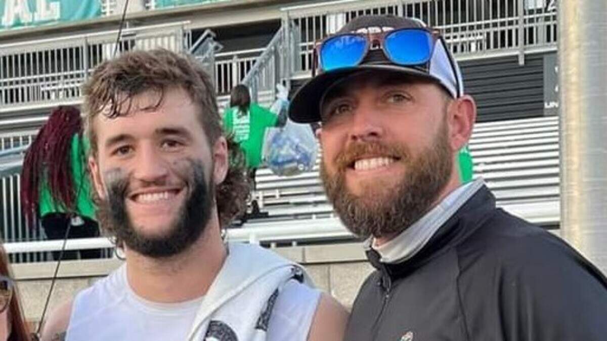 Shayne Milligan, right, poses for a photo with Coastal Carolina QB Grayson McCall. Milligan will be the new football coach at John Paul II.