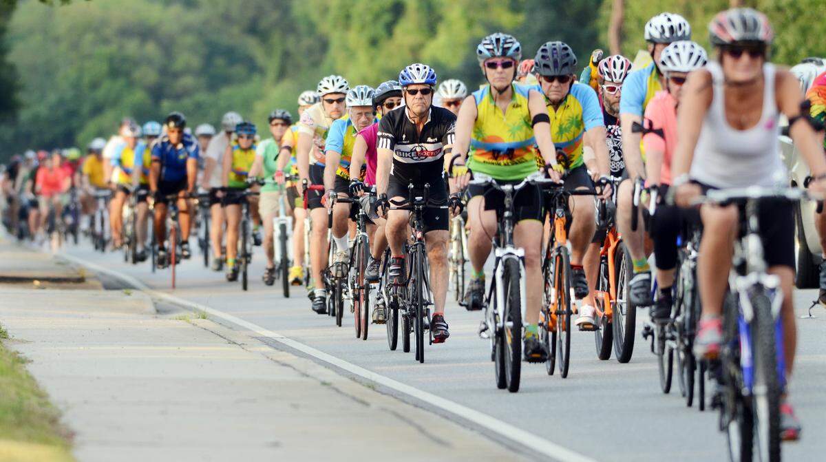 Riders participating in the annual Ride of Silence head down William Hilton Parkway on May 20, 2015.