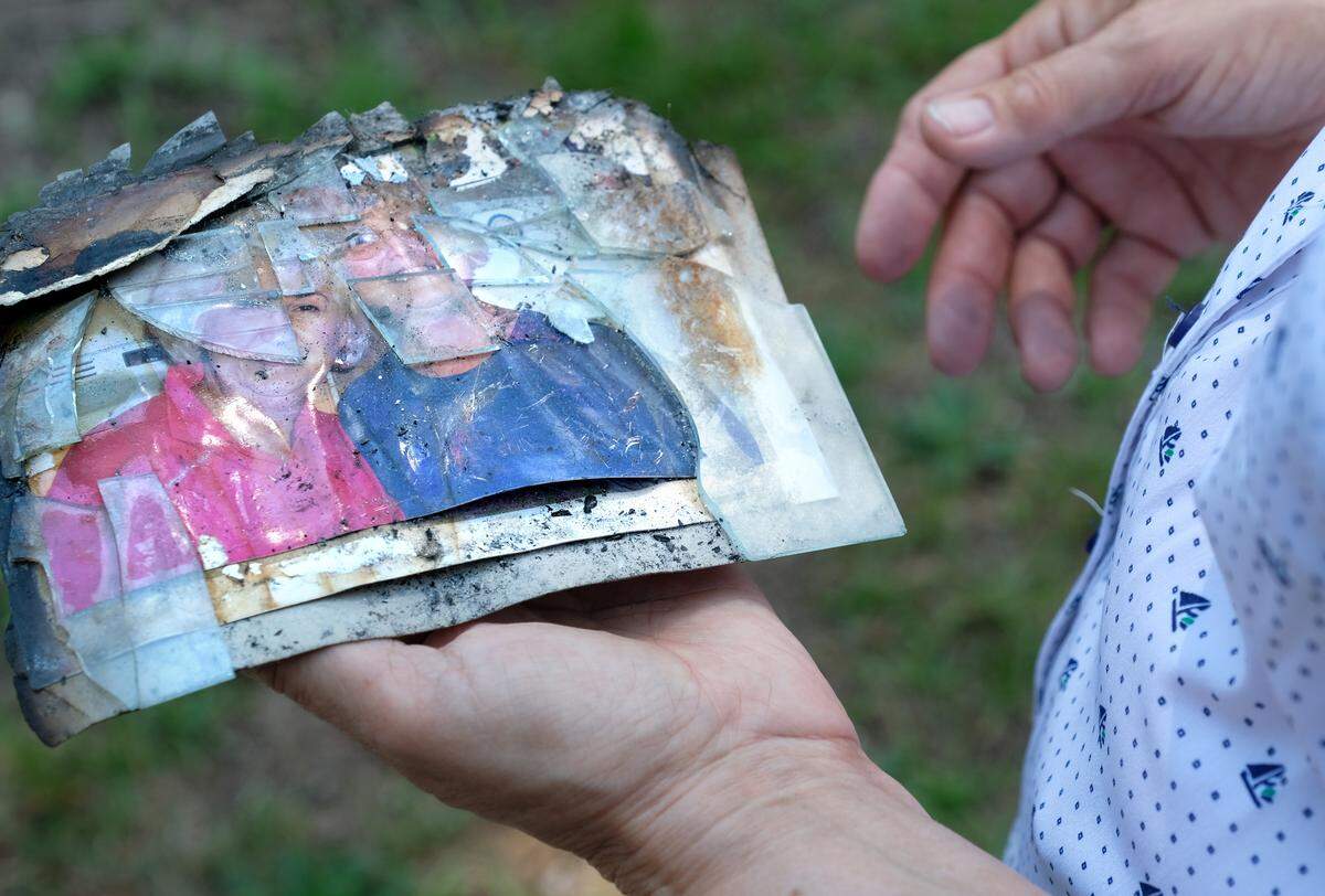 Helen Rivers cradles the only remaining photograph on June 11, 2018 that was recovered from her Seabrook home destroyed by fire on Wednesday, May 9, 2018.