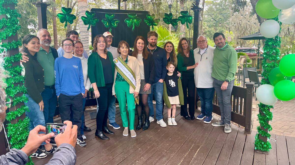 Diane Reilley, center, poses with family at the sashing ceremony on Feb. 11, 2025, when she was named grand marshal of the 40th Hilton Head Island St. Patrick’s Day Parade.