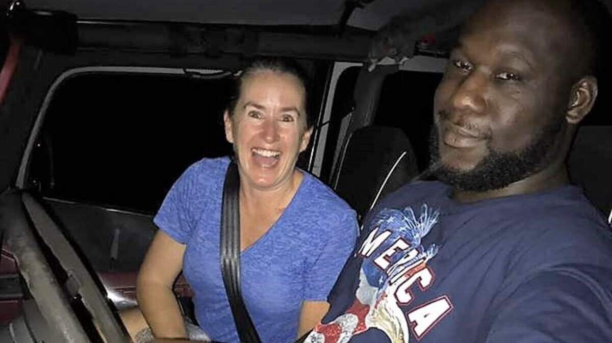 Tracy Sklarin, left, takes a spin with Brandon Spann in the Jeep she just gave him after winning it in a charity raffle.