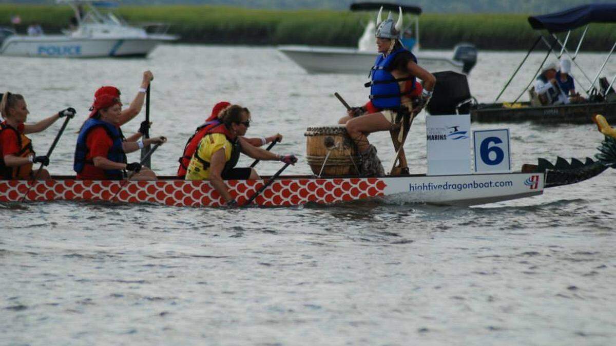 Teams competing in the DragonBoat races at the Beaufort Water Festival on July 25 row down the Beaufort River off Henry C. Chambers Waterfront Park.