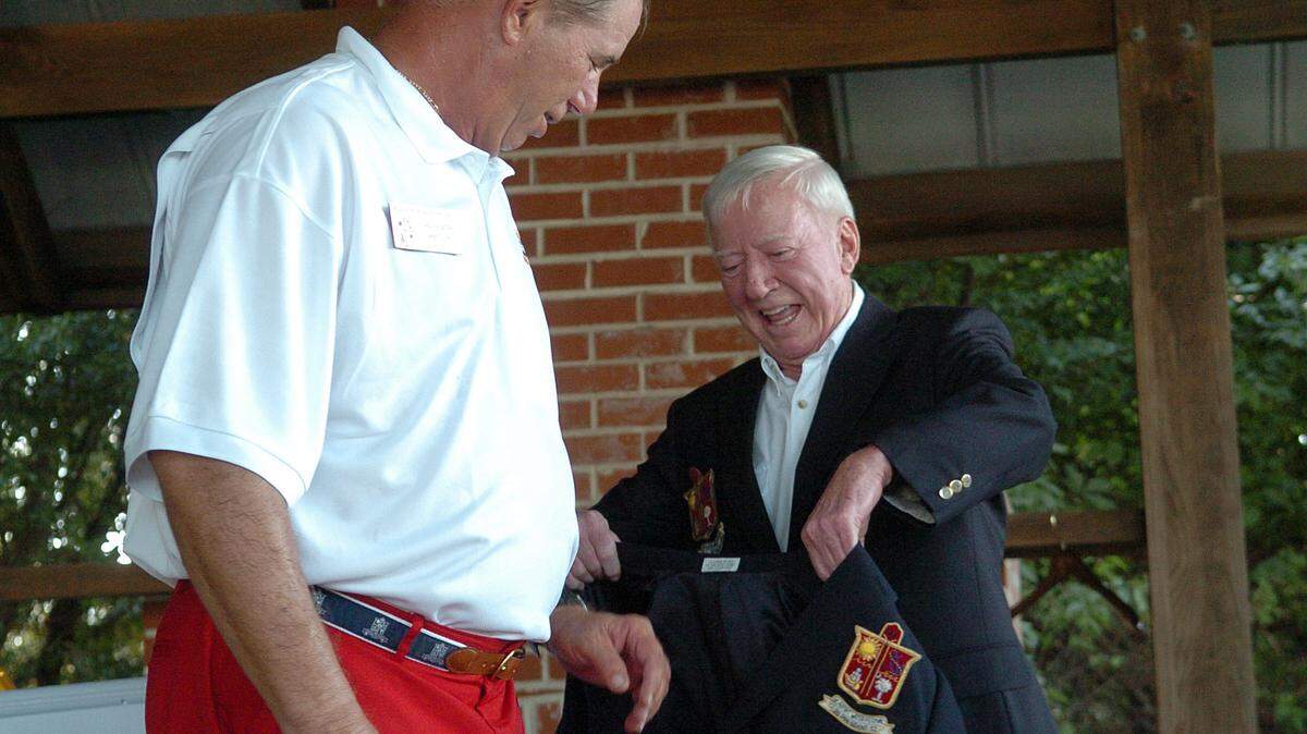 Sammy Gray, right, honors John Gentry, the 2012 Beaufort Water Festival commodore, with the event's signature blazer at a change-of-watch ceremony in 2011. Gray, who served as head of the festival in 1958 and was a longtime owner of Port Royal's 11th Street Dockside Restaurant, died Sunday.