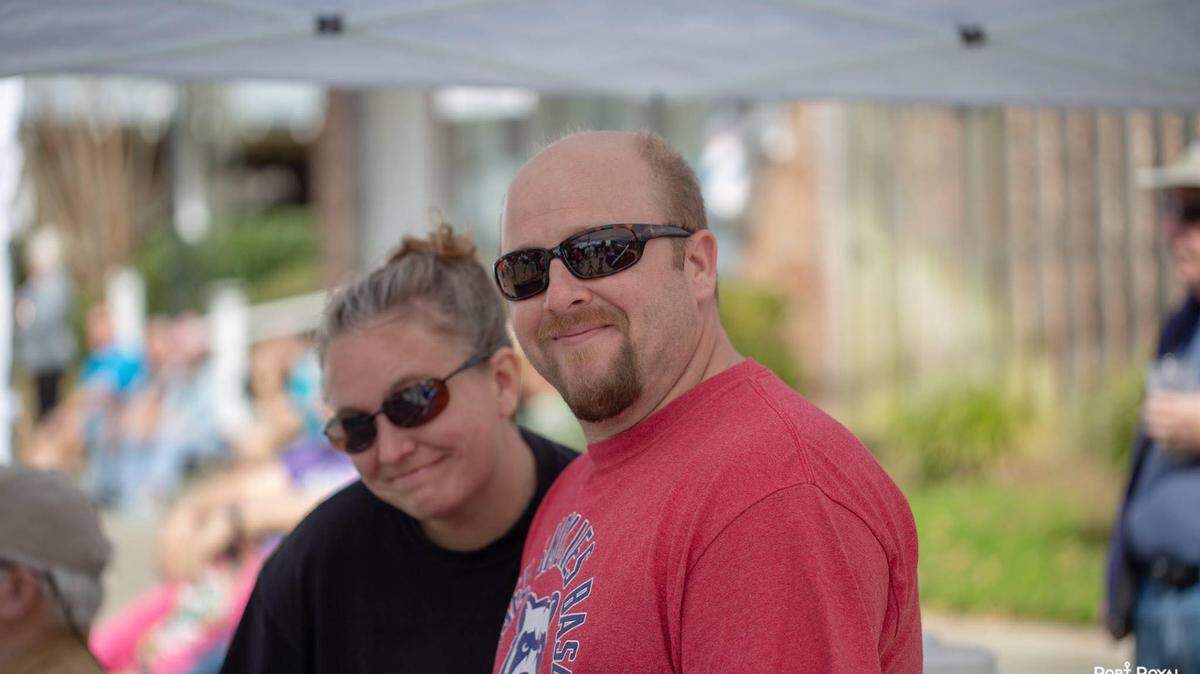 Jeremy Haden stands with his wife, Jen, while working sound at Street Music on Port Royal on Saturday. Haden, who conducted sound for all the town’s events, died unexpectedly later that night.
