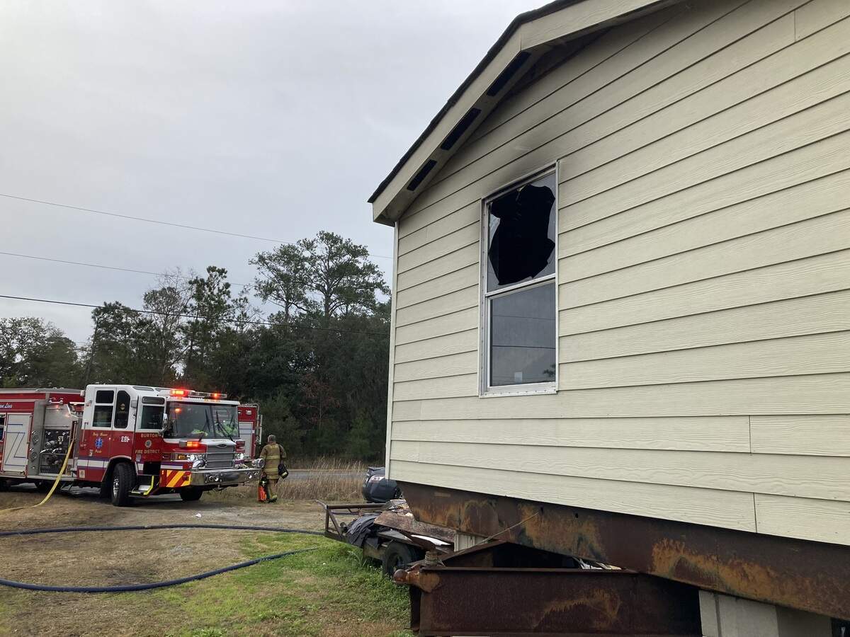 A bedroom in an empty Burton home caught fire Sunday afternoon, causing smoke damage that displaced residents, according to a press release from the Burton Fire District.