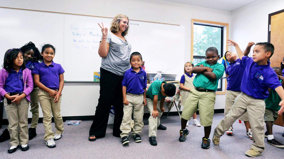 Amanda McTeer, a teacher at Hardeeville's Royal Live Oaks Academy, works with her first-graders during "morning meeting" at the start of the school day on Monday.