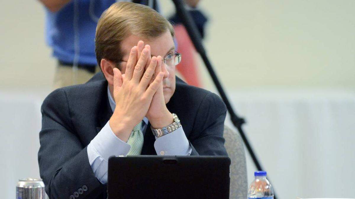 In this 2015 file photo, Beaufort County School District lawyer Drew Davis listens as a member of the public makes a statement to the school board.