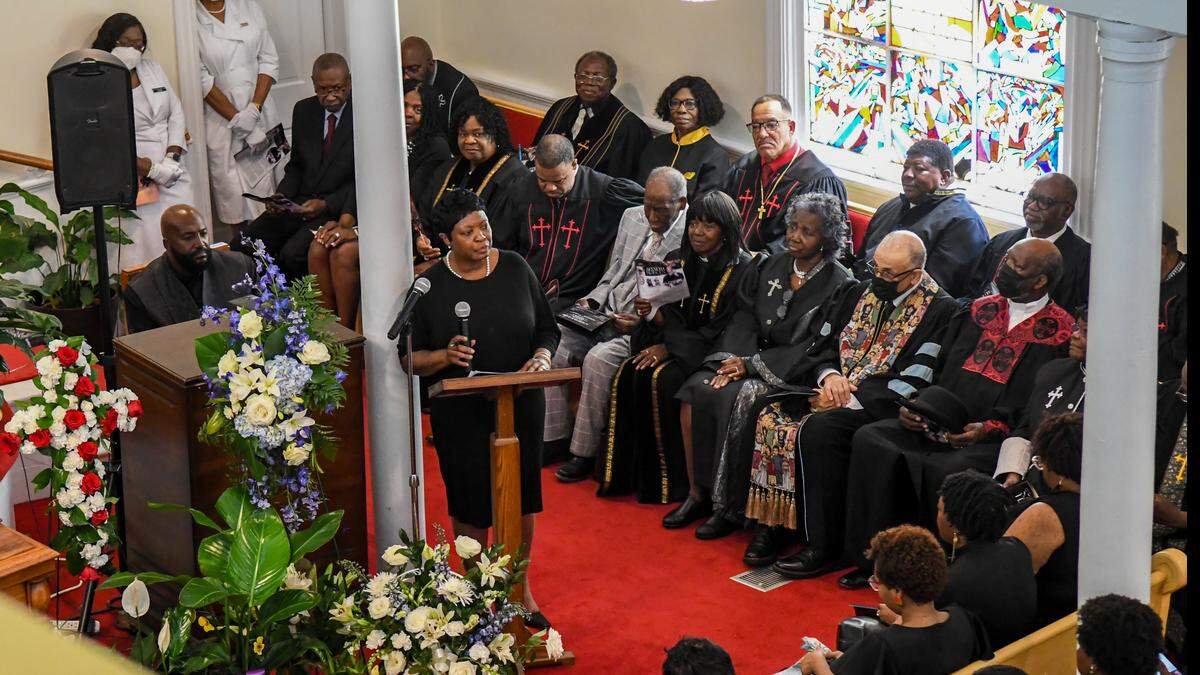 Yassie Hodges, sister to Rev. Kenneth Hodges, tells the congregation stories of their lives on May 3, 2025, at her brothers funeral at the Tabernacle Baptist Church in Historic Downtown Beaufort.