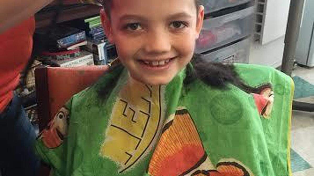 FILE: Alex Arrieta, 9, has his head shaved by his aunt, Andrea Hayes, at Memorial University Medical Center in Savannah on Feb. 16, 2015. Alex was diagnosed with leukemia and began chemotherapy that month.