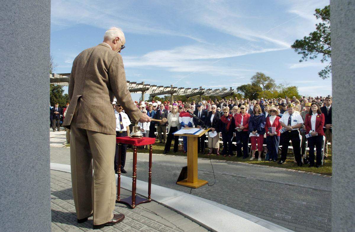 Air Force veteran George McKnight, who spent more than seven years as a Vietnam War POW, rings the Eleventh Hour Bell during the 2008 Veterans Day memorial service at Shelter Cove Community Park on Hilton Head Island. He lived on Hilton Head for 22 years.