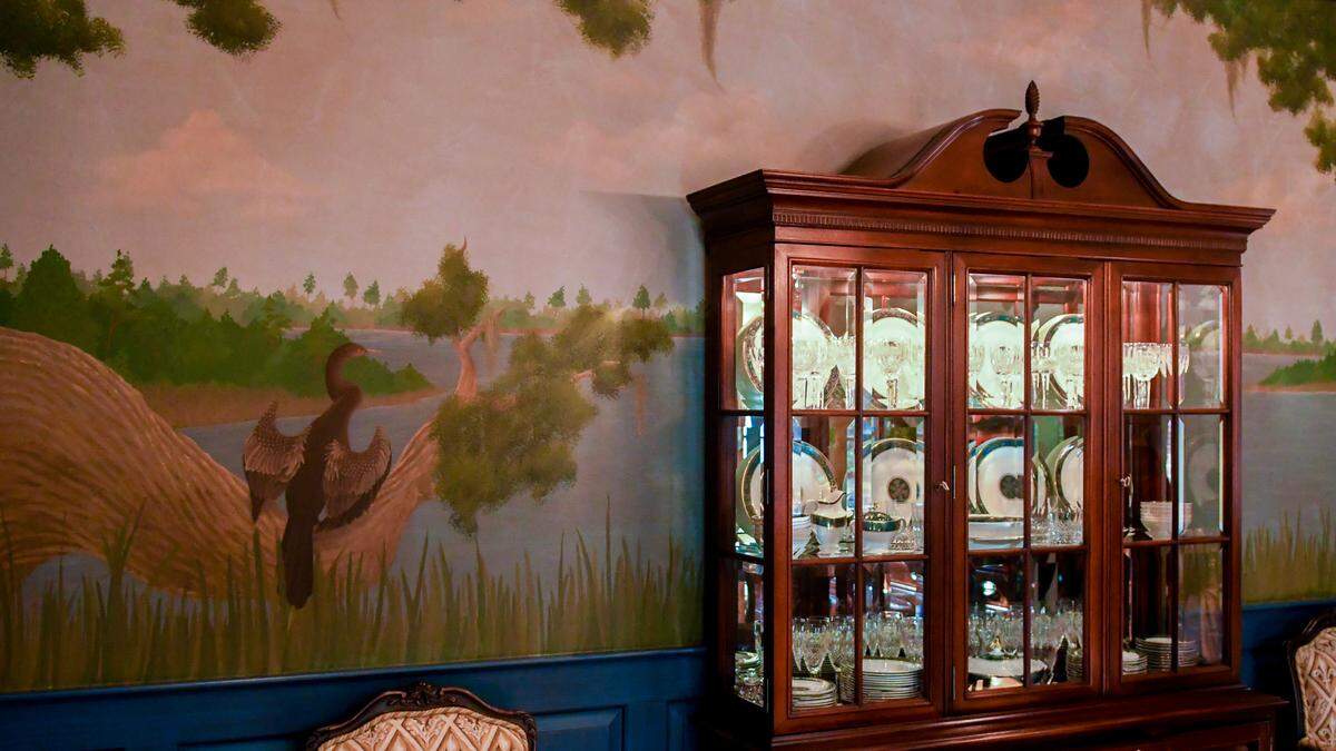 A mural — one side featuring a marsh, the other ocean scenery — is hand-painted in the formal dining room in this photo taken on Dec. 2, 2022 at 32 W. Beach Lagoon Rd listed for sale at $5.75 million on Hilton Head Island.
