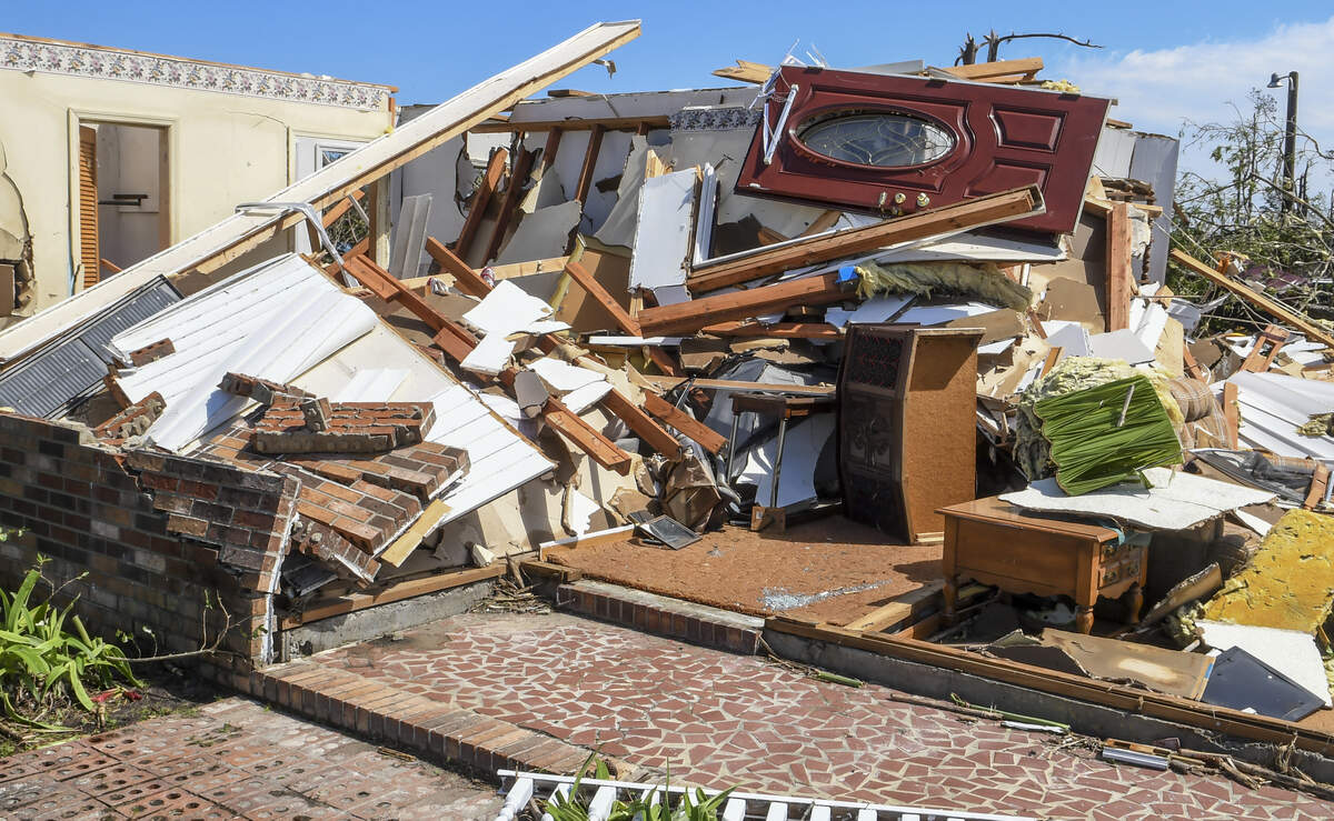 The front door to a home in Lena, South Carolina, rests on what remains of the house that was pushed in by a tornado on the morning of Monday, April 13, 2020.