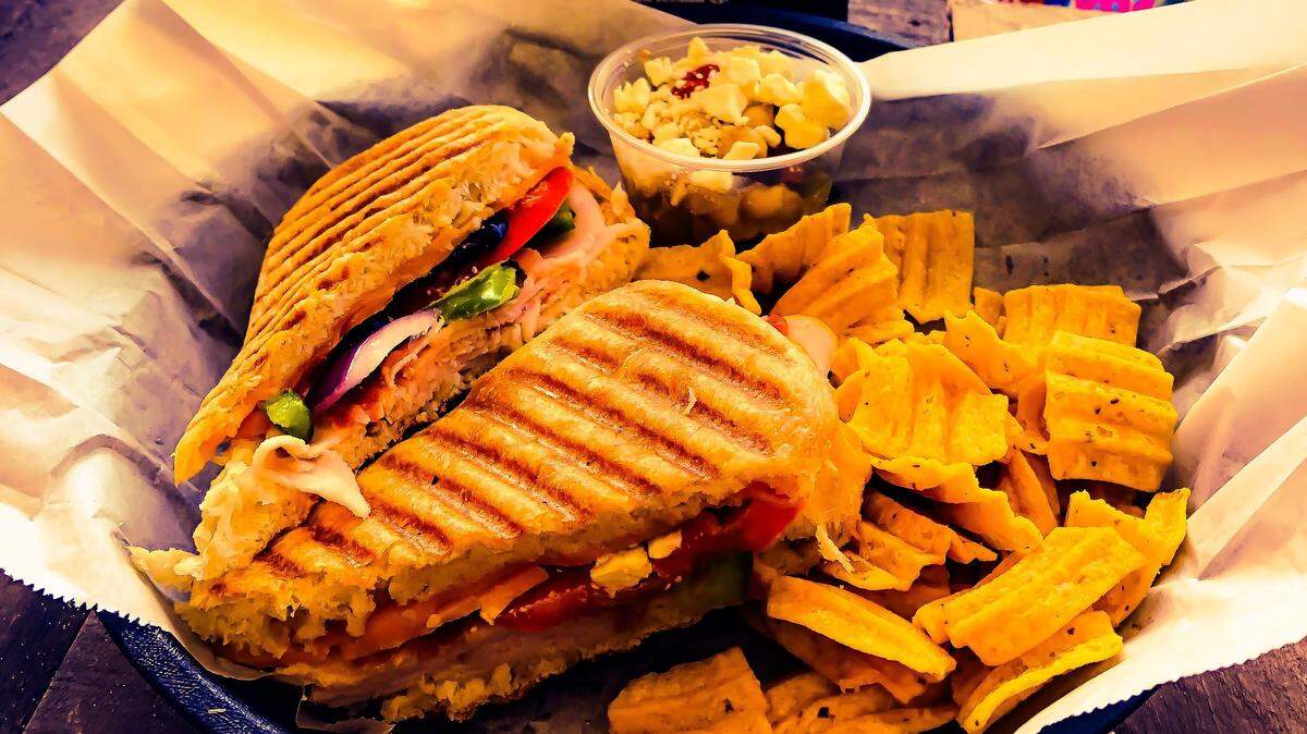 Jasper's Frosty Dog Cafe offers beach-goers and those near Coligny Circle a selection of paninis, salads, ice cream and frozen yogurt. The restaurant opened on May 1 and is within the Surfs Up shop on North Forest Beach Drive.