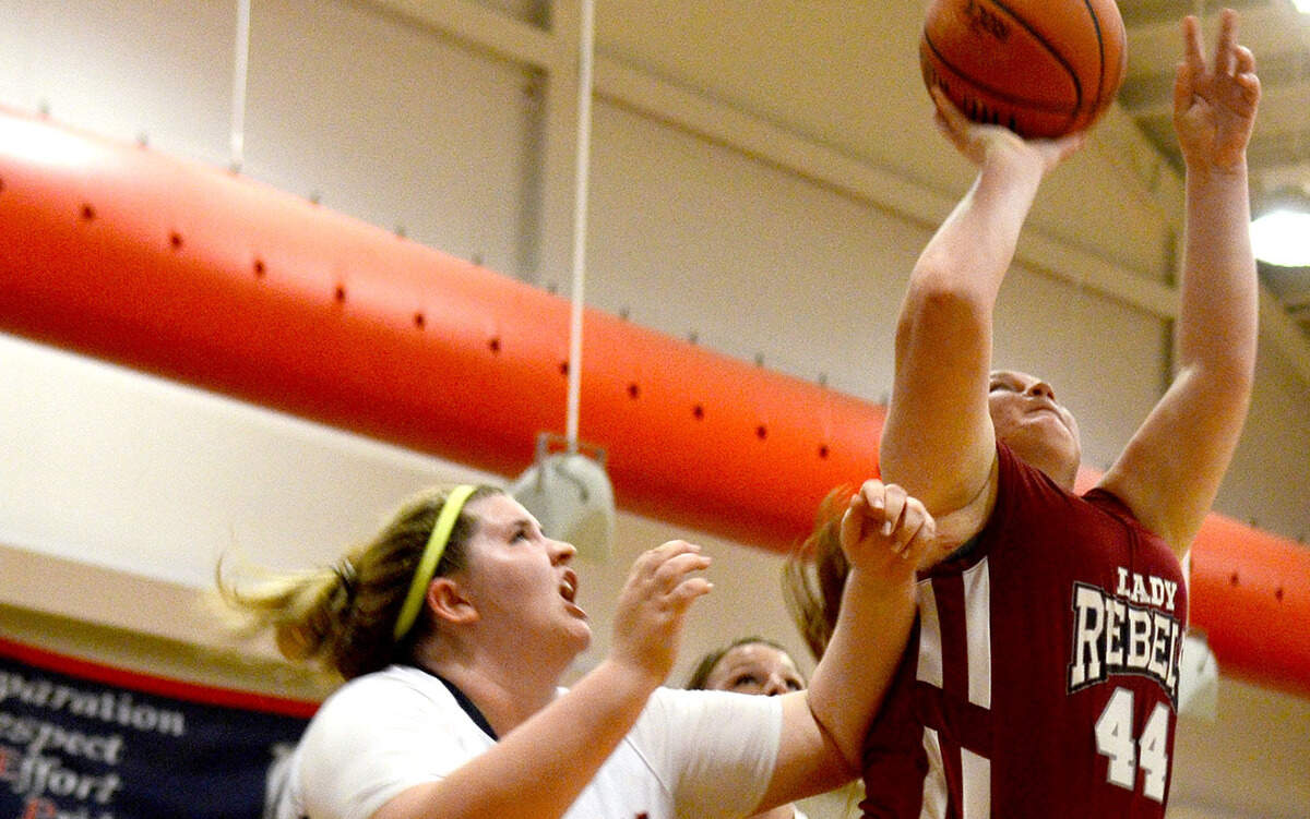 Thomas Heyward's Jamie Davis tries to shoot the ball as Hilton Head Prep?s Maddie McDonald tries to stop her during their game on Friday night at Hilton Head Preparatory School on Hilton Head Island.