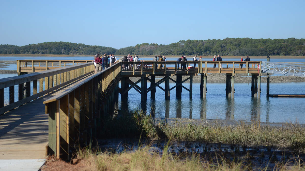 The Hilton Head Island Rowing and Sailing Center at Squire Pope  Community Park officially opened to the public on Dec. 1, 2014, with a  ribbon cutting ceremony at the dock.