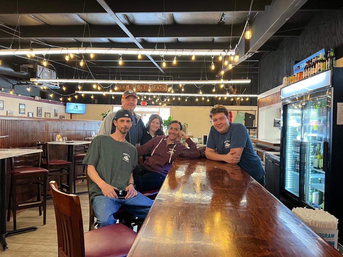 Dough Boys partners Chris Gregory and his wife, Kim Gregory, back row; Mike Kelly, front from left; Megan Gorden, and Brendan Dobis talked to an The Island Packet reporter at their new Bluffton pizza restaurant.