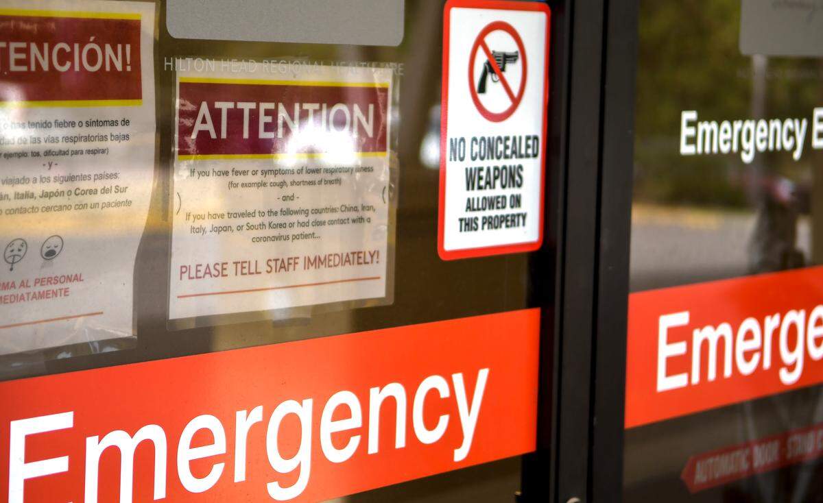 A sign at Hilton Head Hospital’s emergency entrance on Friday, March 13, 2020, instructs those with a fever or respiratory illness, those who’ve had contact with an individual with the coronavirus and those that traveled outside of the United States to immediately tell staff. Hospitals and clinics around Beaufort County are attempting to keep their staff and other patrons free from the COVID-19 pandemic.