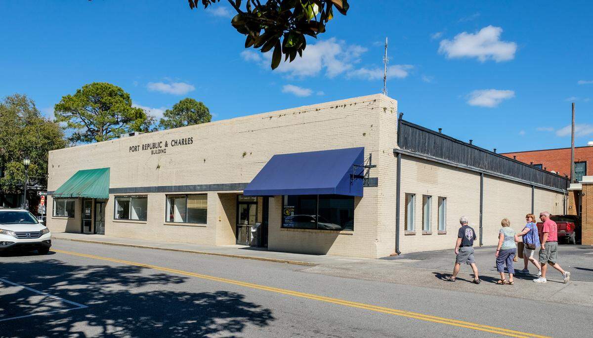 People walk by the Port Republic & Charles Building on Thursday, March 11, 2021 located at 211 Charles Street in Historic Downtown Beaufort. On Wednesday, the building was approved to be demolished for a three-story apartment complex.  