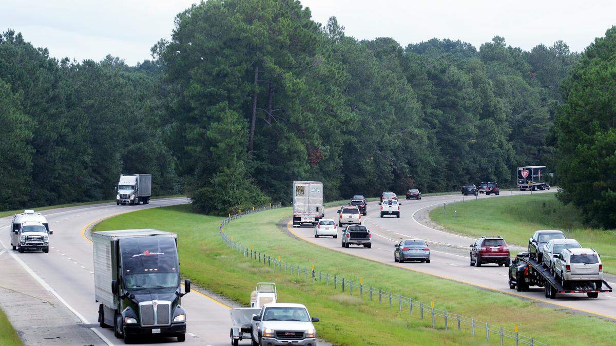 Traffic emerges from a section of I-95 that is divided by a tree-lined median in this view looking north from the Exit 8 overpass in Hardeeville on Thursday. SCDOT engineers are recommending a certain amount of tree-clearing in the median along portions of I-95 in Jasper County.
