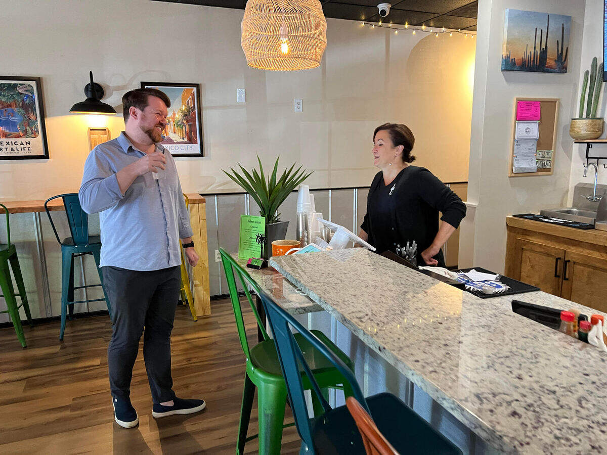 Eoin O’Driscoll chats with Cactus Street Cantina co-owner Tracy Wilson while he waits for a take-out order at the Hilton Head restaurant.