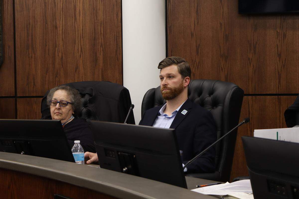 Beaufort County Councilman Logan Cunningham sits behind the lectern on Dec. 8. The councilman brought forward a “motion to rescind,” or otherwise overturn, a landslide vote made in September regarding the controversial Pine Island golf course development.