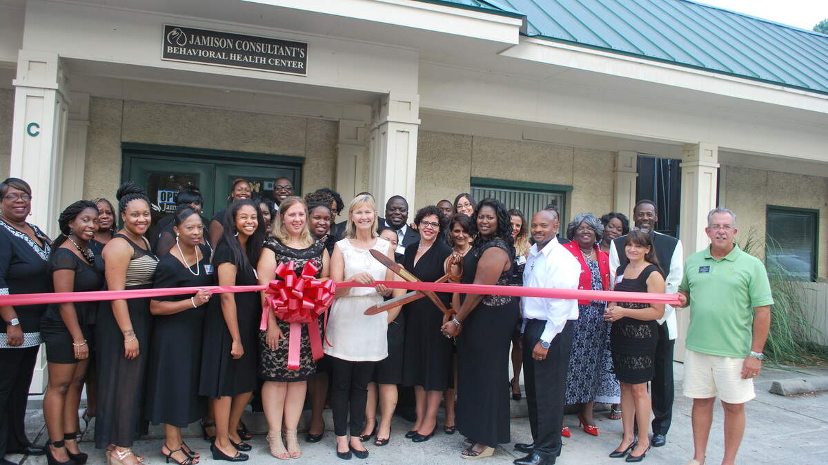 Stephanie Jamison, CEO of Jamison Consultants Behavioral Health Center, cuts a ribbon outside her building at 167 Bluffton Road on June 25, 2014. Bluffton Mayor Lisa Sulka also attended the ceremony and open house event for the center, which opened in April and provides mental health, substance abuse and behavior modification treatment to adults, adolescents and children.