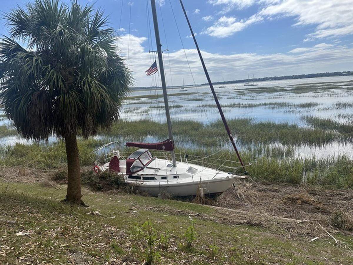 Several boats remained beached in the marsh along Bay Street in Beaufort in the wake of Tropical Storm Helene.